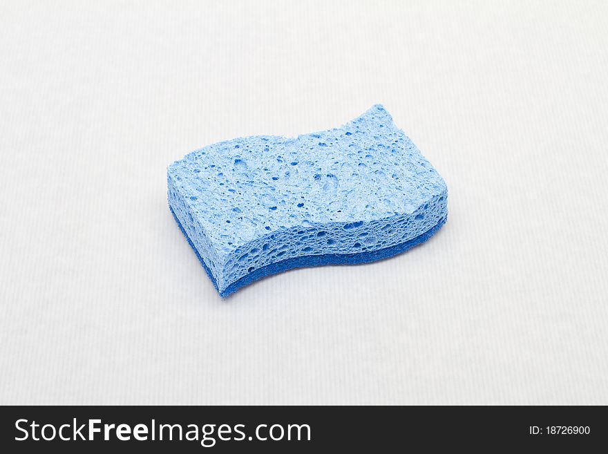 Blue sponge in the white background