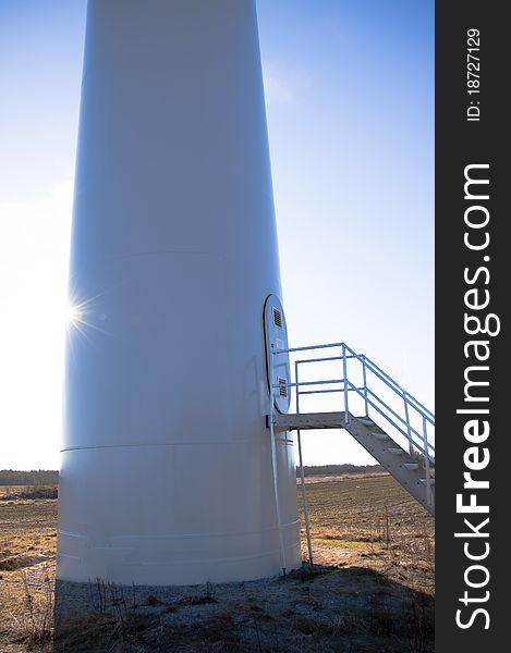 Wind turbine against blue sky