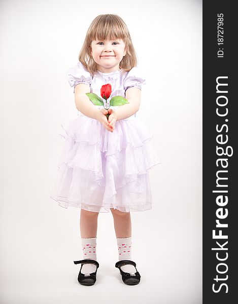 Young girl in pink dress with red rose. Young girl in pink dress with red rose