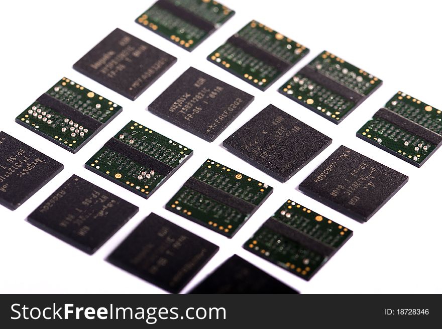 Close view of a bunch of computer memory chips isolated on a white background.