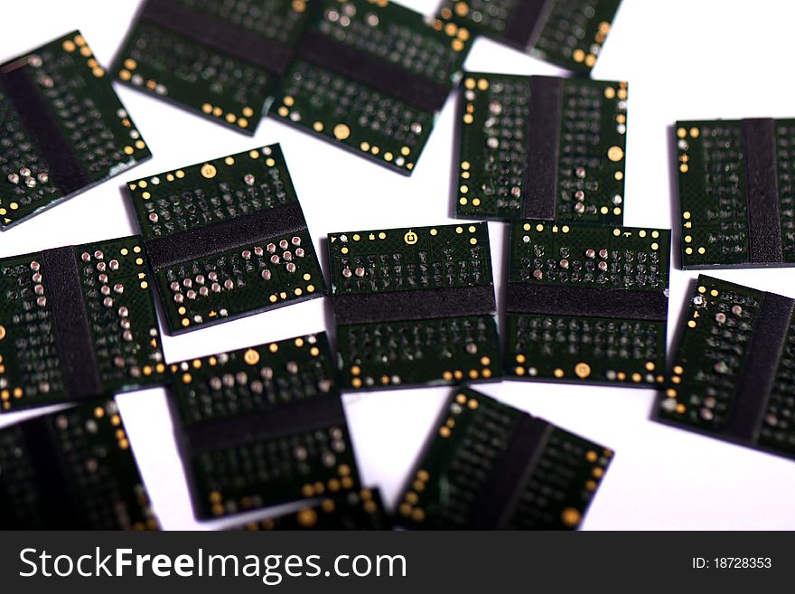 Close view of a bunch of computer memory chips isolated on a white background.