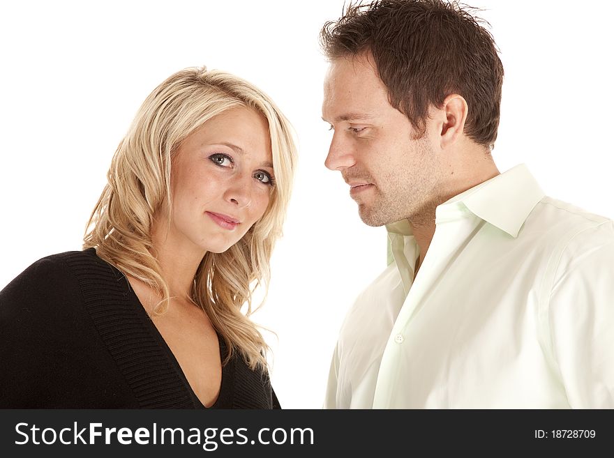 A close up of a couple with the man looking down at the women. A close up of a couple with the man looking down at the women.