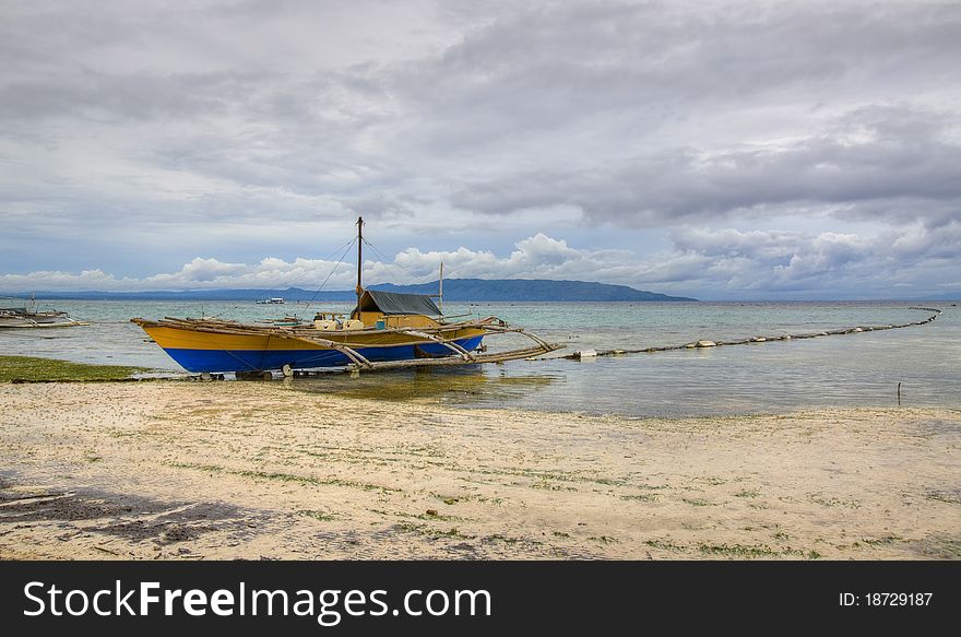 HDR of a fishing boat on the beach in Bohol, Philippines. HDR of a fishing boat on the beach in Bohol, Philippines