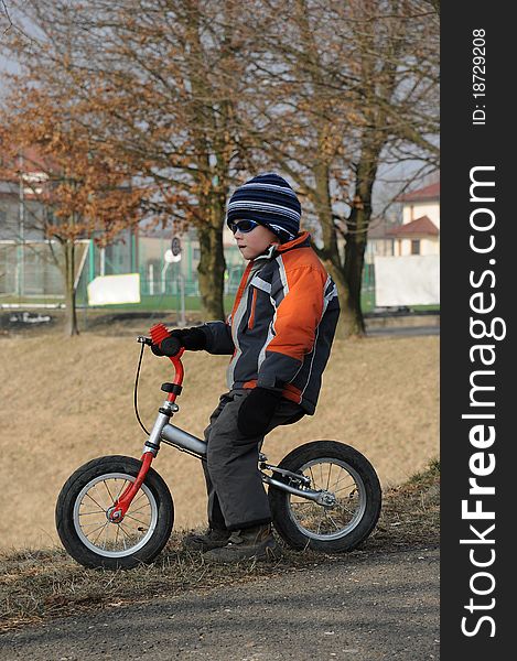 Child Sitting On Bicycle