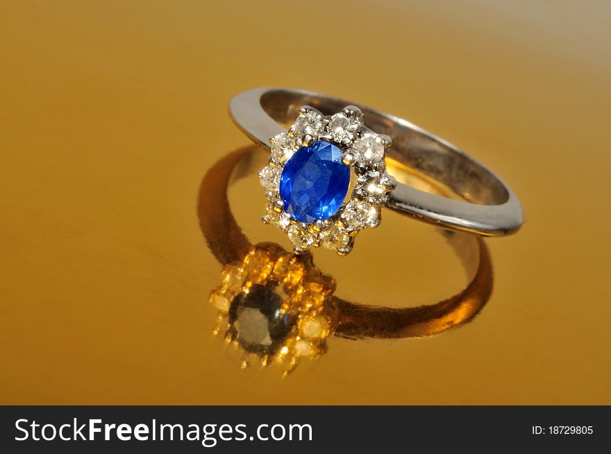 Platinum ring with diamonds and blue sapphire. Platinum ring with diamonds and blue sapphire