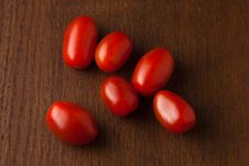 Six Fresh Red Cherry Tomatoes On A Wood Table Stock Images