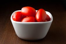 A Bowl Of Cherry Tomatoes On A Wood Table. Stock Image