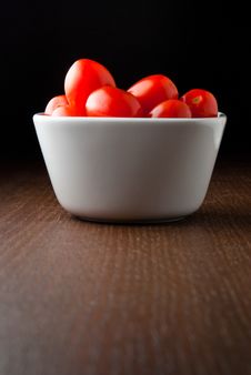 A Bowl Of Cherry Tomatoes On A Wood Table. Stock Image A Bowl Of Cherry Tomatoes On A Wood Table. Stock Image