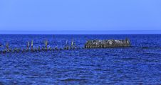 Old Wooden Pier In The Sea. Royalty Free Stock Photo Old Wooden Pier In The Sea. Royalty Free Stock Photo