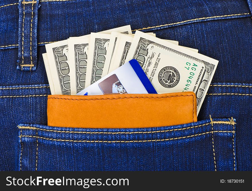 Money and credit card in jeans pocket - shopping background