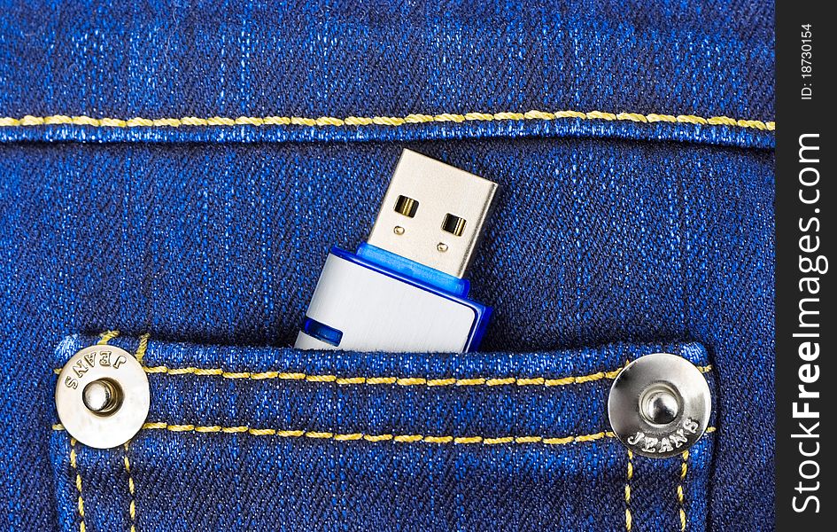 Flash memory in jeans pocket - technology background