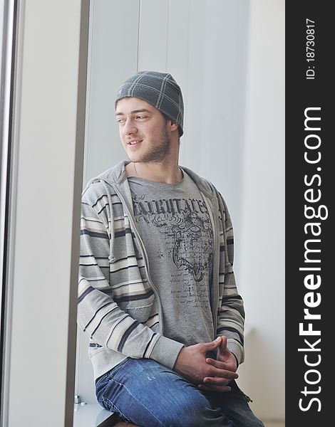 Happy young man in fashion clothing posing. Happy young man in fashion clothing posing