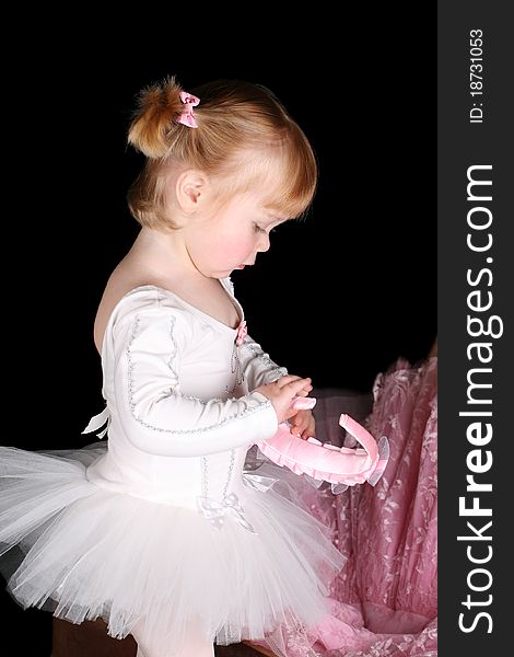 Little ballet toddler wearing a white tutu. Little ballet toddler wearing a white tutu