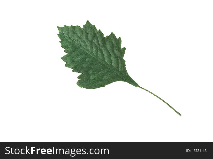 Artificial green leaf on a white background