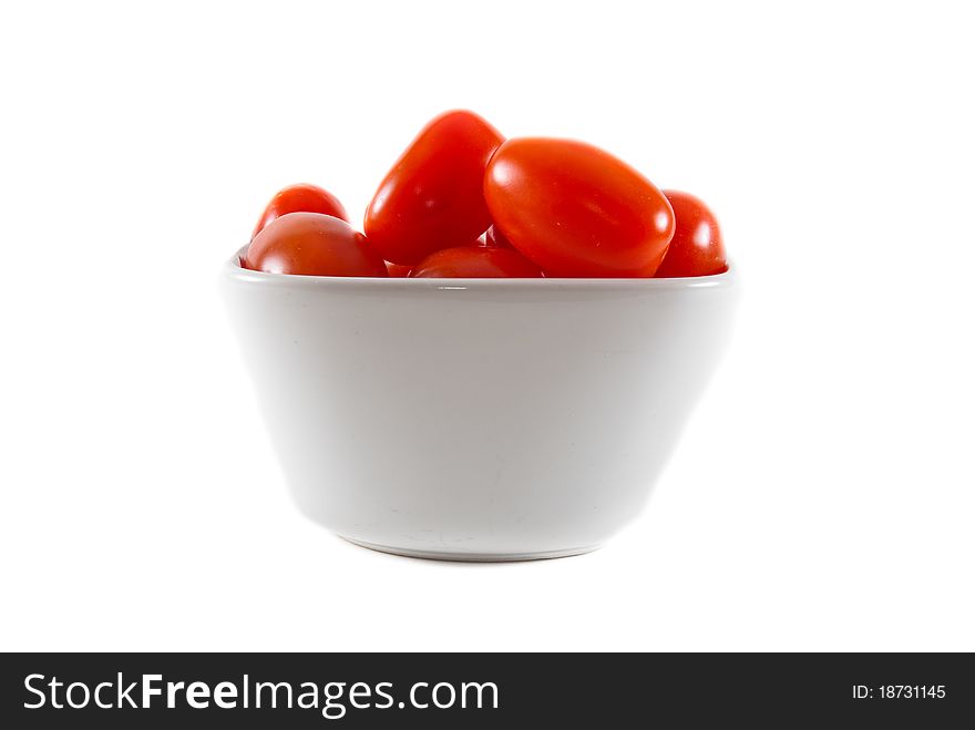 Bowl Of Cherry Tomatoes On Isolated Background.