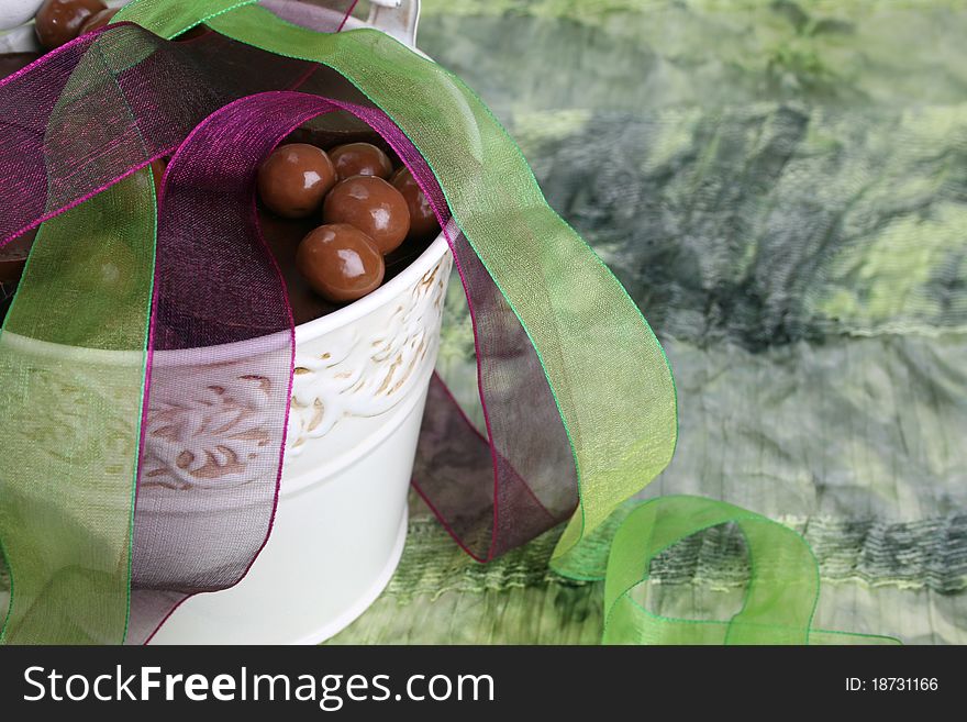 Decorative bucket with chocolate and organza ribbon. Decorative bucket with chocolate and organza ribbon