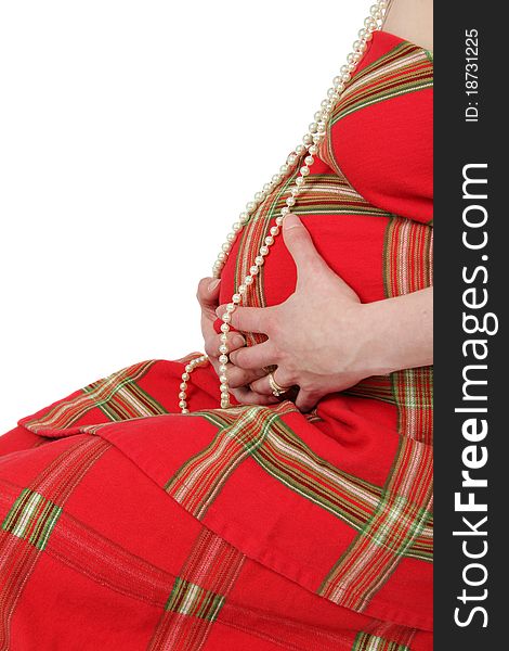 Beautiful pregnant belly with pearls wrapped in scottish cloth. Beautiful pregnant belly with pearls wrapped in scottish cloth
