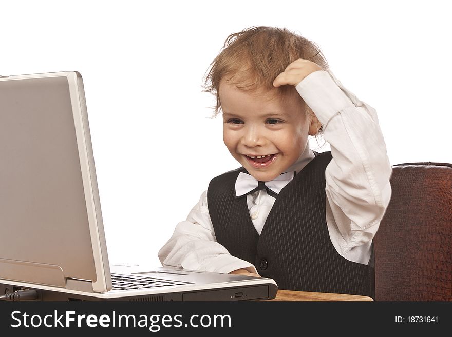 Little child and laptop. Isolated on white background