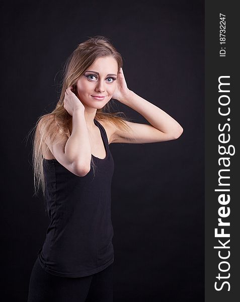 Young Beauty Blond Girl In Black Tank Top