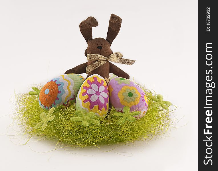 Easter bunny with egg in the nest