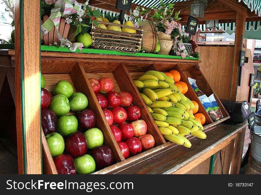 A cart full of fruits for sale. A cart full of fruits for sale