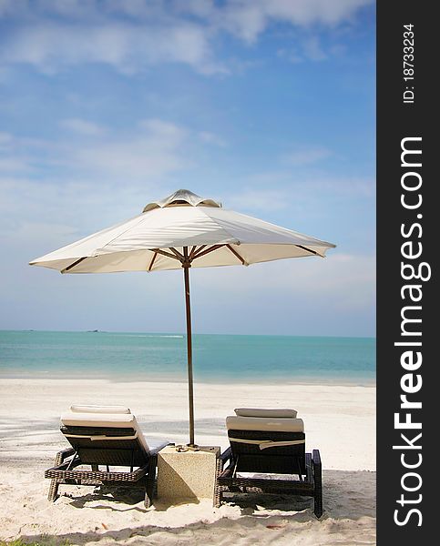 Chairs And Umbrella On Beach