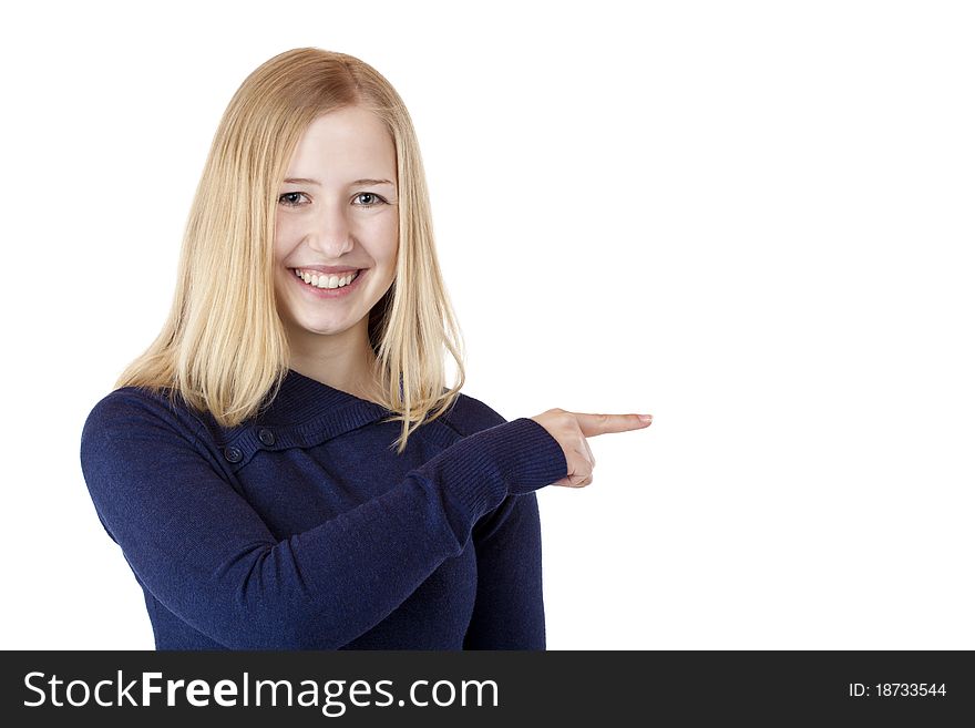 Young beautiful blond woman shows with finger on ad space. Isolated on white background. Young beautiful blond woman shows with finger on ad space. Isolated on white background.