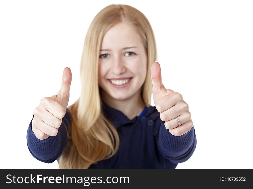 Young beautiful smiling woman shows both thumbs up. Isolated on white.