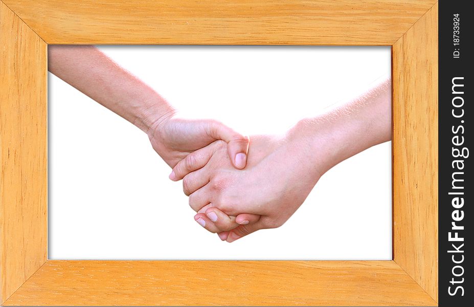 Holding hands in wood frame isolated on white background