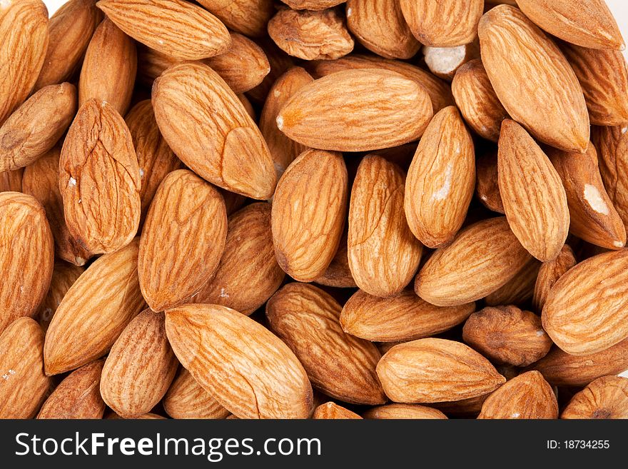 Background of fresh dry fresh brown almonds