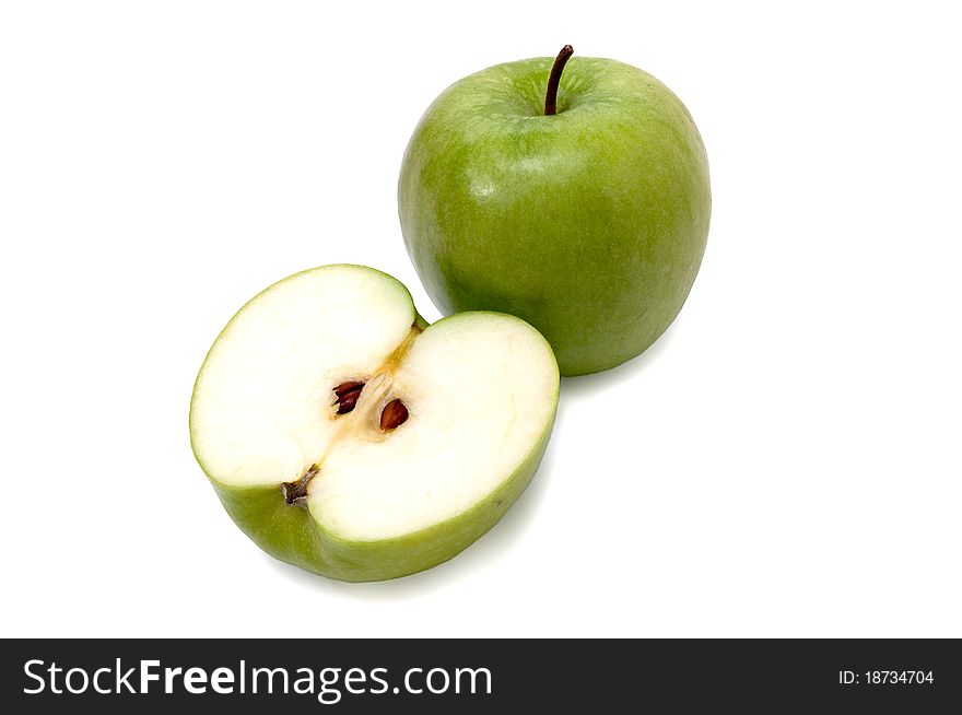 Isolated green apples with one cut in half. Isolated green apples with one cut in half