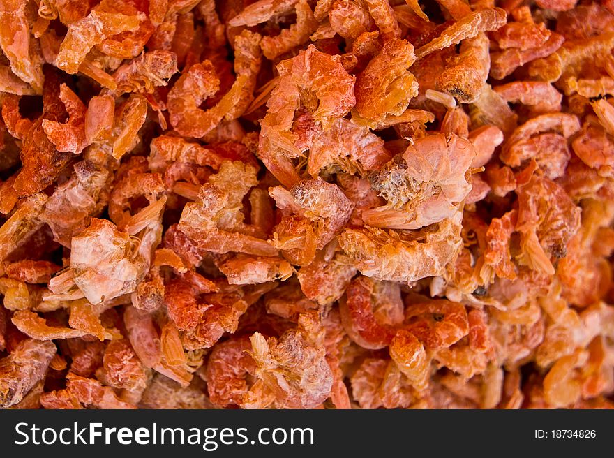 A pile of orange dried shrimp