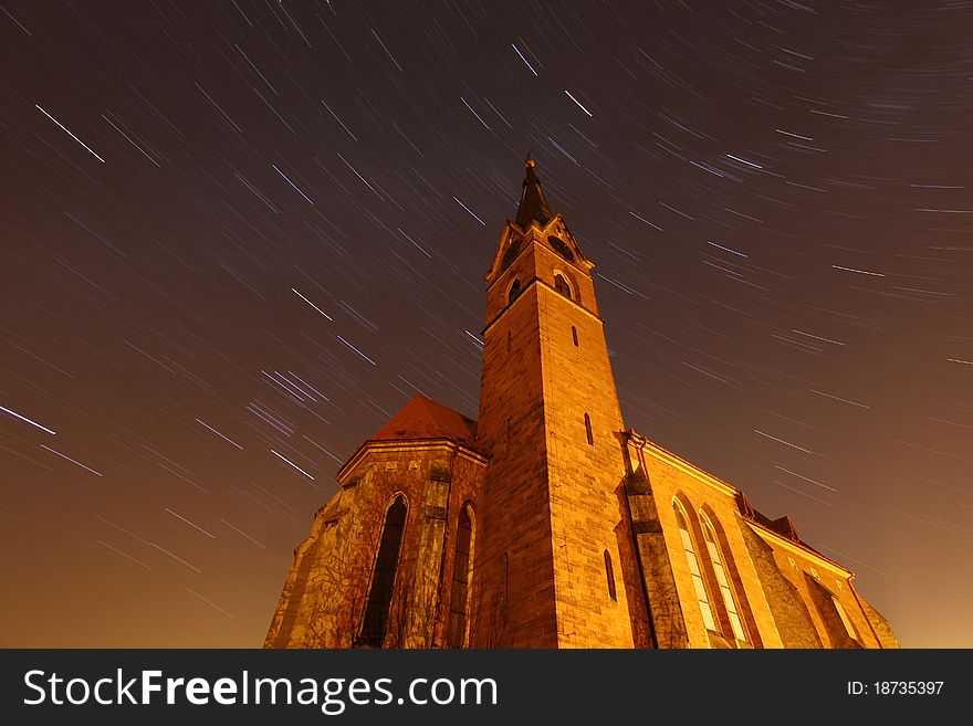 Old church and moving stars at night. Old church and moving stars at night