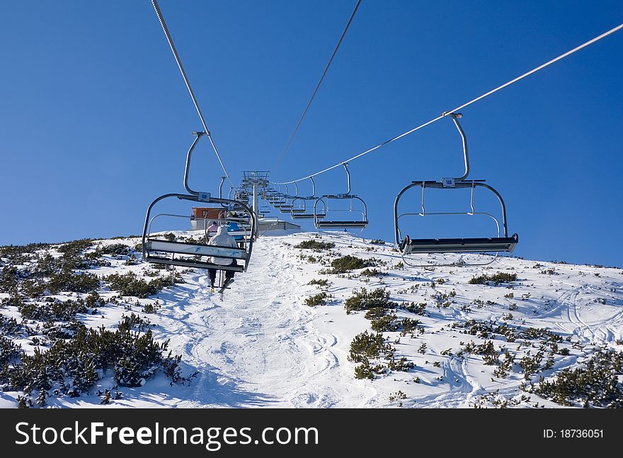Chair ski lift at alpine ski resort Borovets, Bulgaria. Chair ski lift at alpine ski resort Borovets, Bulgaria