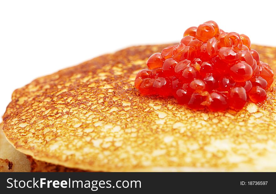 Studio photography of a pancakes with caviar close up macro with unfocused background. Russian traditional food for the holidays (maslenitsa)