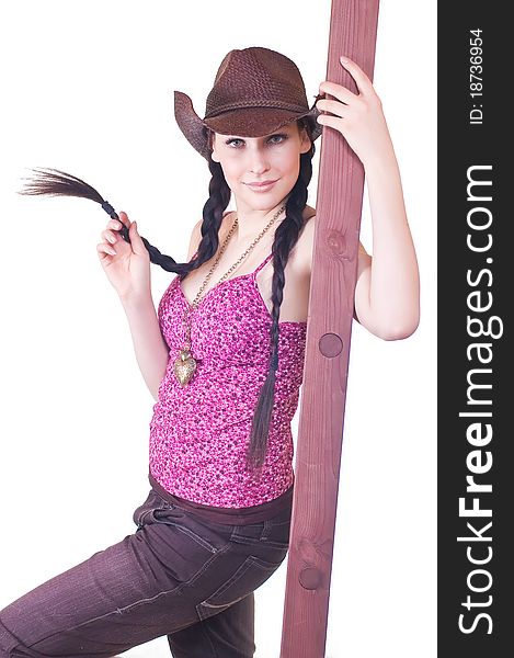 Lovely young girl the cowboy with a ladder on a white background close up. Lovely young girl the cowboy with a ladder on a white background close up