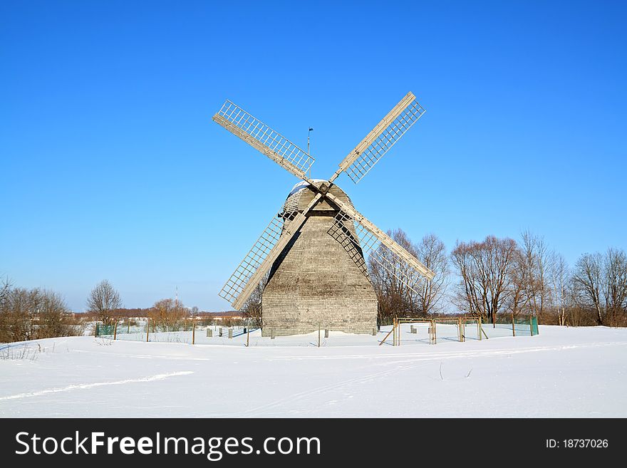 Aging rural mill on snow field