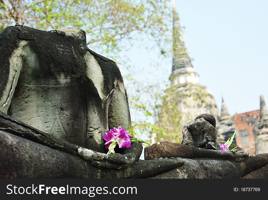 Ruin buddha with flower in wat phrasisunpeth ayutthaya thailand. Ruin buddha with flower in wat phrasisunpeth ayutthaya thailand