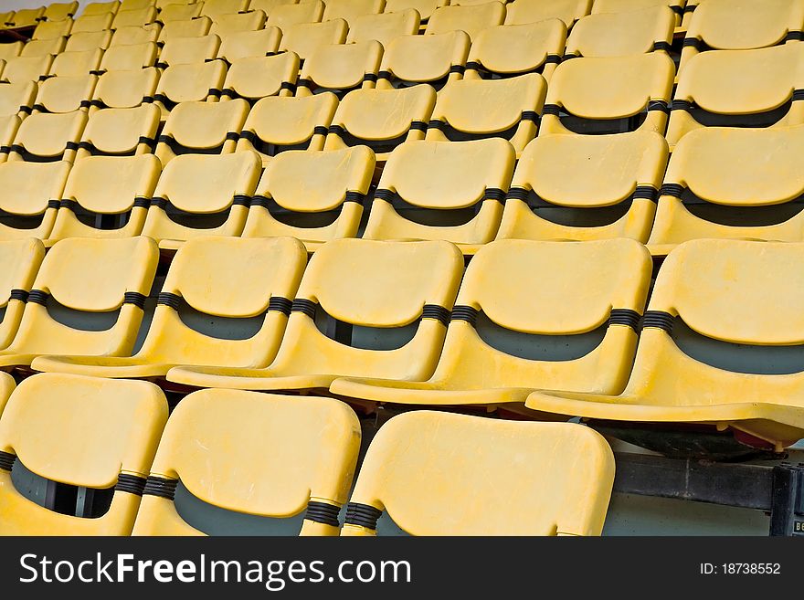 Yellow Seat Pattern in Football Stadium