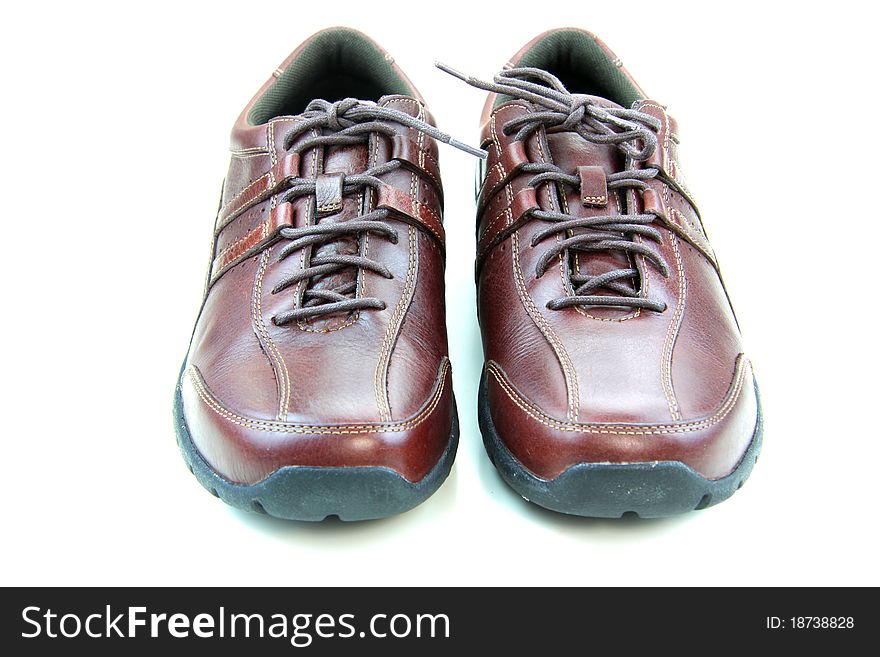 Pair of expensive leather shoes on white background