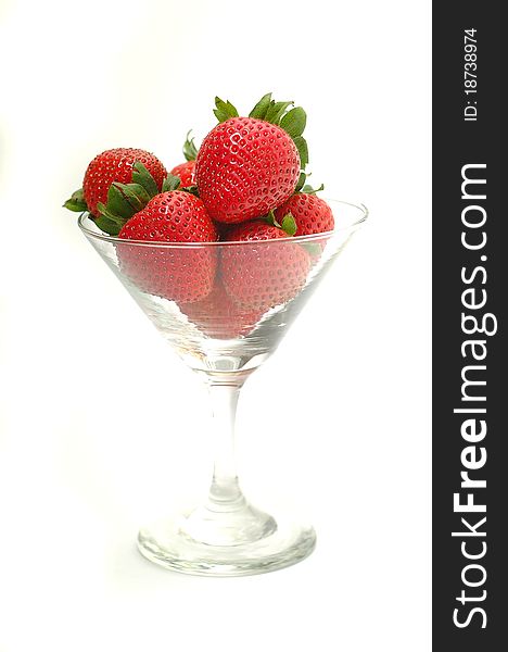 Strawberries in wine glass on white. Strawberries in wine glass on white.