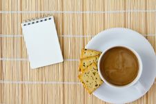 White Cup Of Hot Coffee And White Sketch Book Stock Images