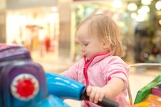 Adorable Baby Ride On Baby Motorcycle Stock Image