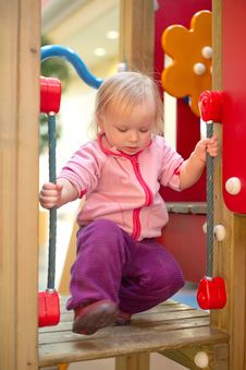 Adorable Baby Climb To Baby Slide On Playground Royalty Free Stock Photography