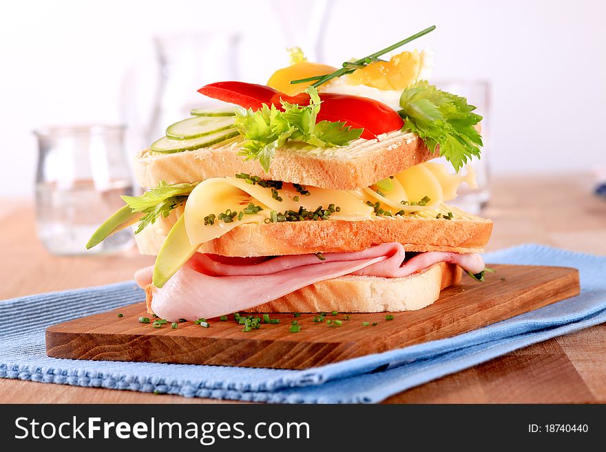 Ham and cheese sandwich on a cutting board