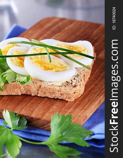 Whole grain bread with slices of boiled egg. Whole grain bread with slices of boiled egg