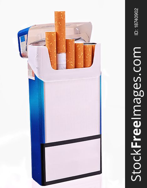 Open pack of cigarettes on a light background