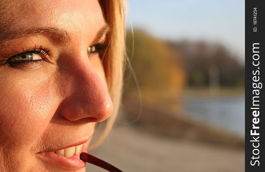 Beautiful blond girl in the sunset light