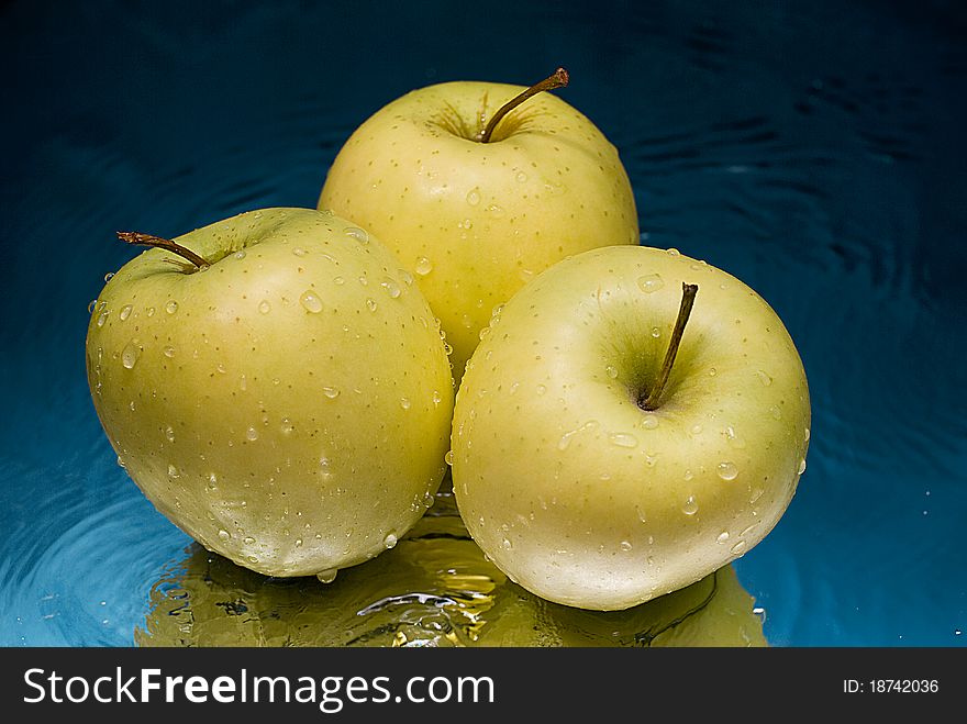 Apples splash in splashes of water for freshness giving. Apples splash in splashes of water for freshness giving