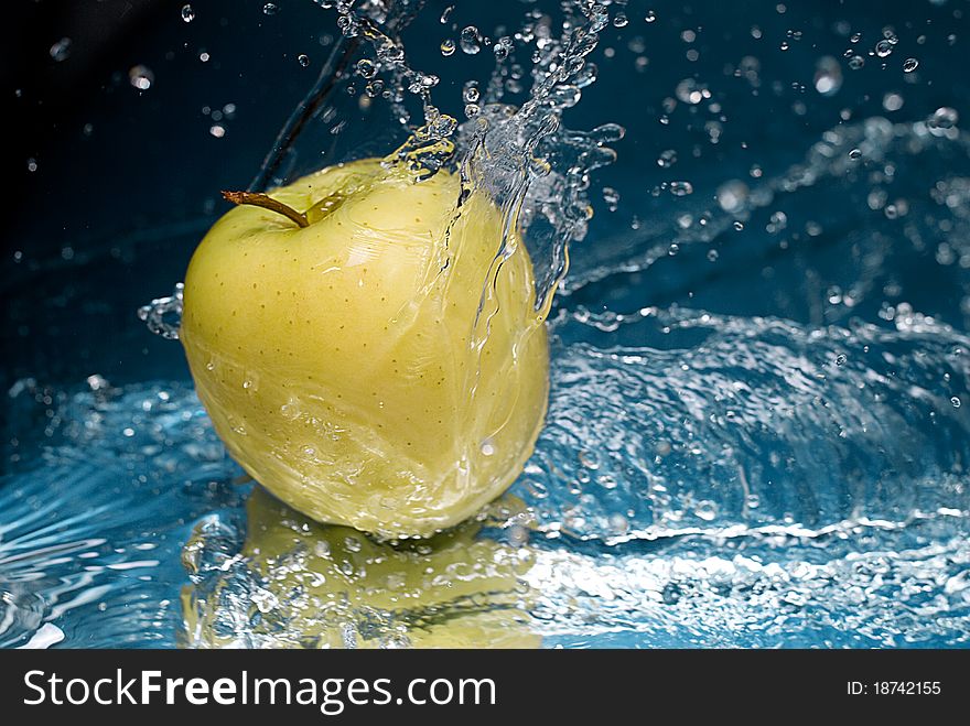 Apple splash in splashes of water for freshness giving. Apple splash in splashes of water for freshness giving